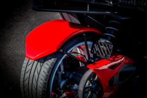 A close up of the rear wheel on a motorcycle