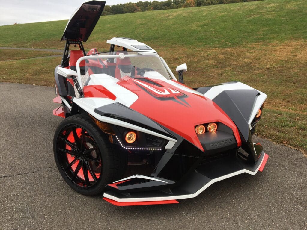 A red and black car with an open hood