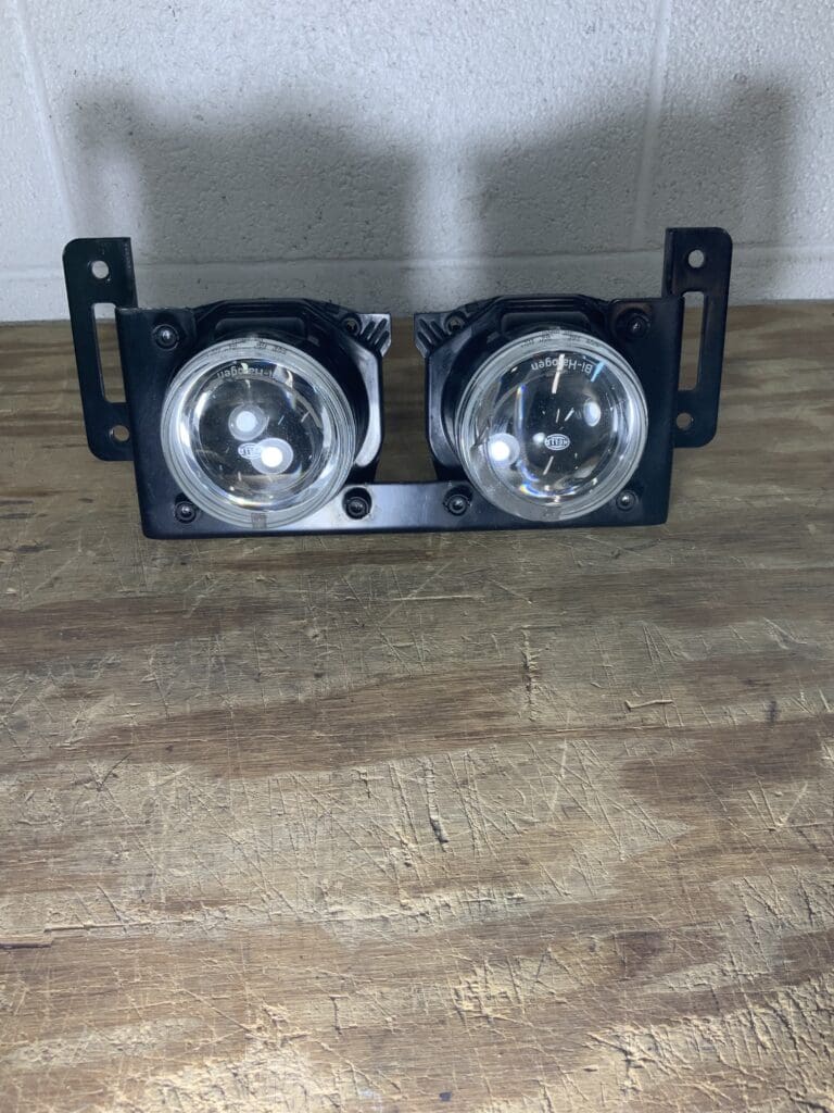 A pair of lights sitting on top of a wooden floor.
