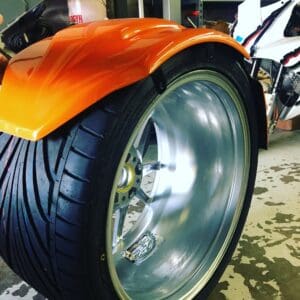 A close up of the tire on a motorcycle