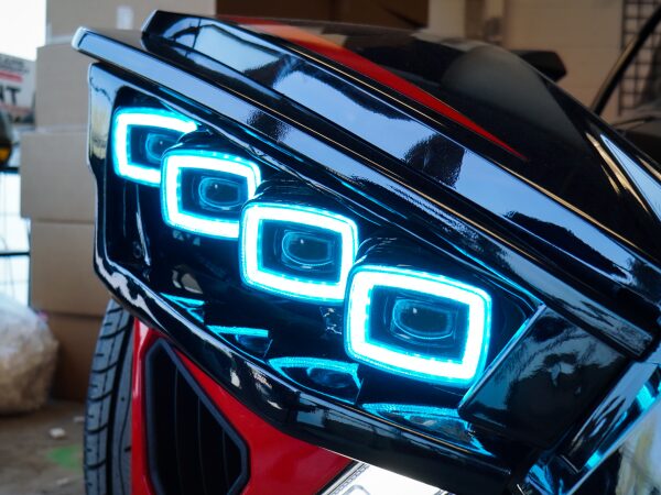 Square Shaped Blue Color Lights on the Front of a Bike