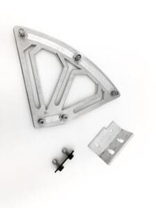 A metal piece of art with some parts missing.